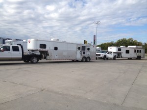 convoy of 4 big rigs going to horse camp